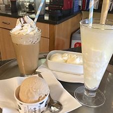 Frappé with cream, horchata and a tub of ice cream on the bar